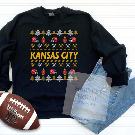 Black sweatshirt with 'Kansas City' design, football, and jeans on a white background