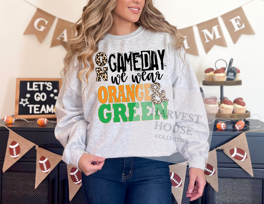 On Gameday We Wear Orange And Green Shirt